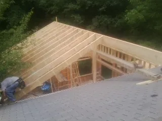 Framing a new roof addition that ties into an existing shingle roof in Black Creek